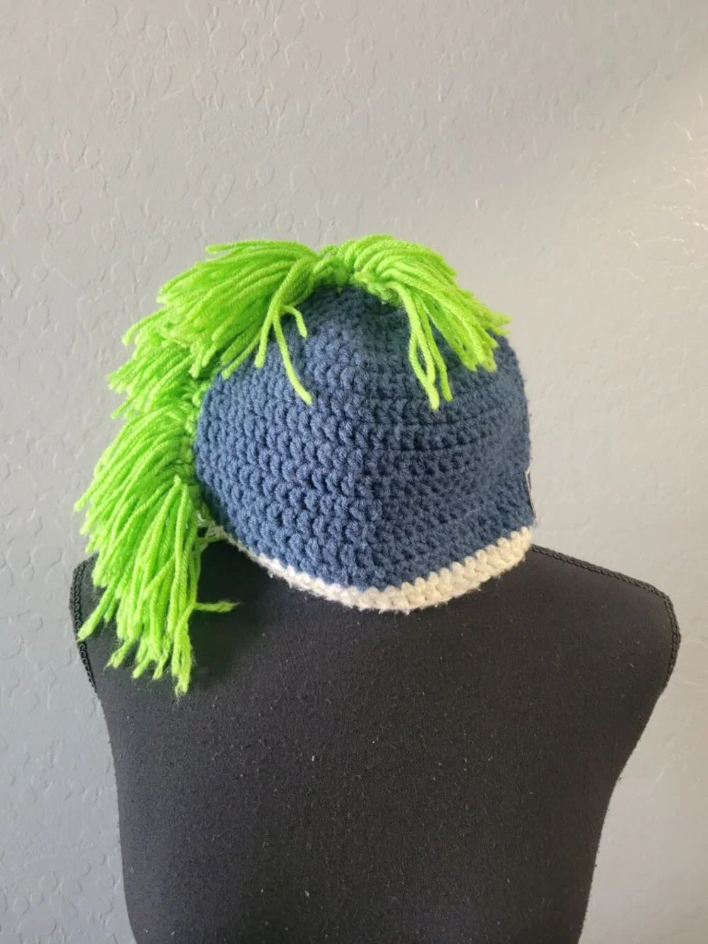 hand-crocheted Seattle Seahawks beanie blue yarn, a white brim, bright green Hat
